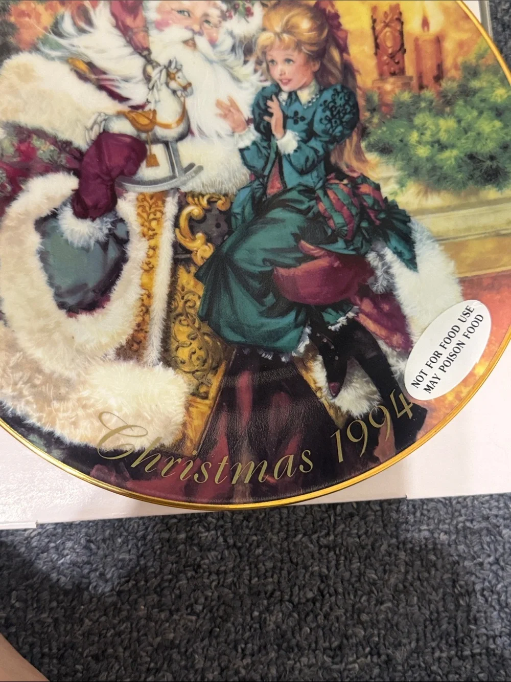 Avon 1994 Christmas Decorative Plate with Santa and Girl. 22K gold rim.